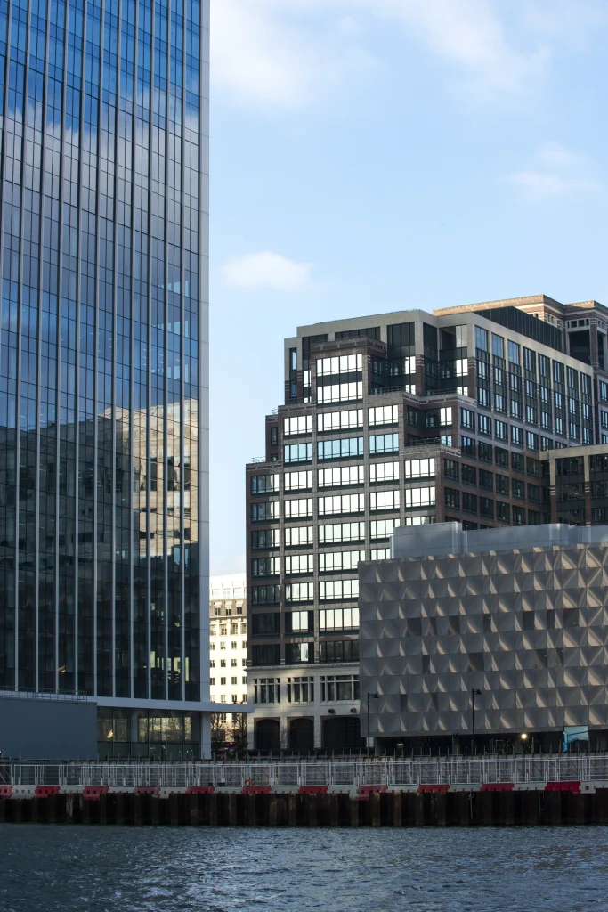 Modern office buildings by the waterfront in Germany, symbolizing working in Germany and its dynamic professional environment.