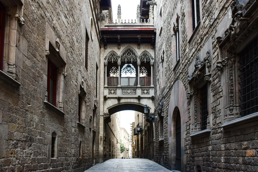 Medieval streets in the Gothic Quarter of Barcelona with the Pont del Bisbe.