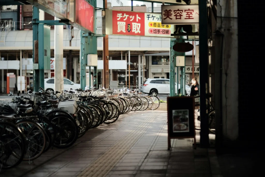 Row of bicycles parked in a designated area on a Japanese street, famous way of transportation in Japan