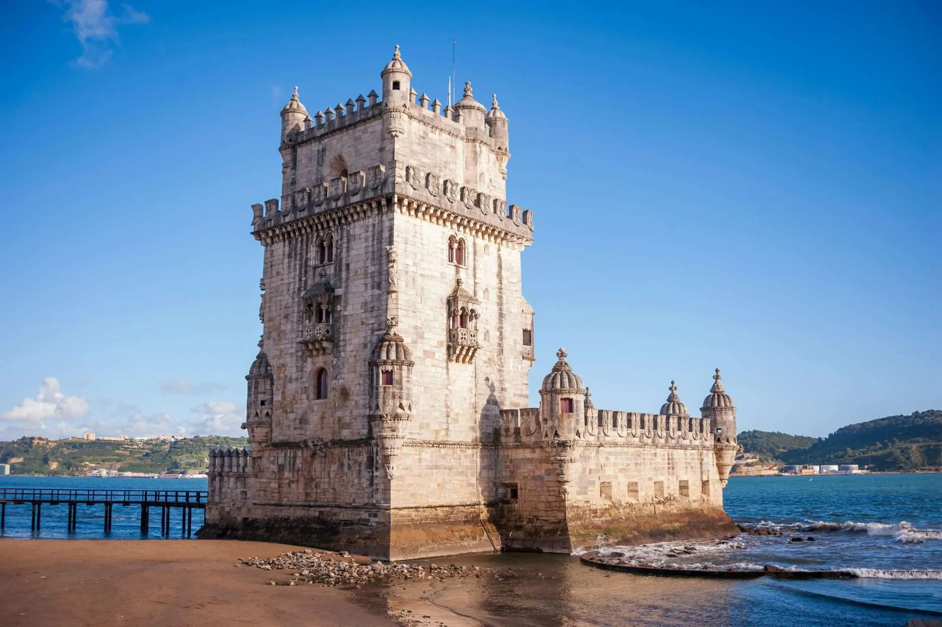 What to do in Lisbon? Visit the historic Belém Tower, a UNESCO-listed fortress that symbolizes Portugal’s Age of Discoveries along the Tagus River.