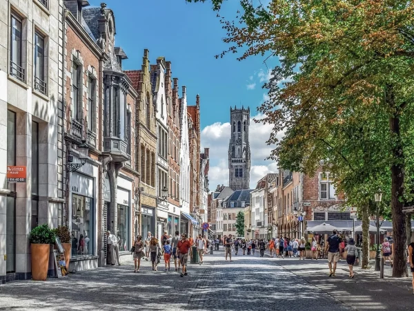 charming street in Bruges, showcasing rental opportunities in Belgium’s picturesque cities with historic homes and modern apartments.