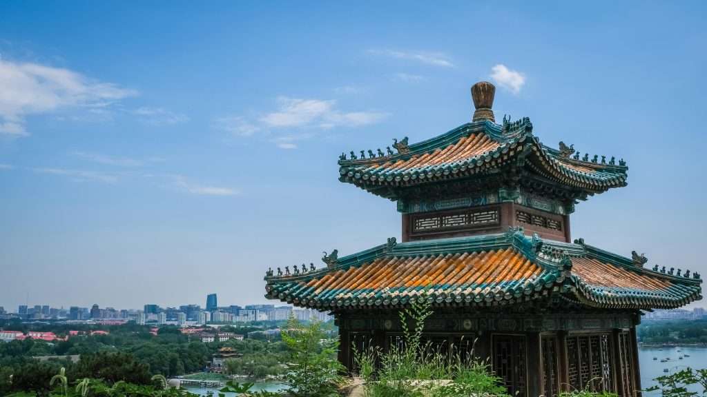 A traditional Chinese temple with a stunning skyline, showcasing cultural sites travelers can visit with a Chinese visa.