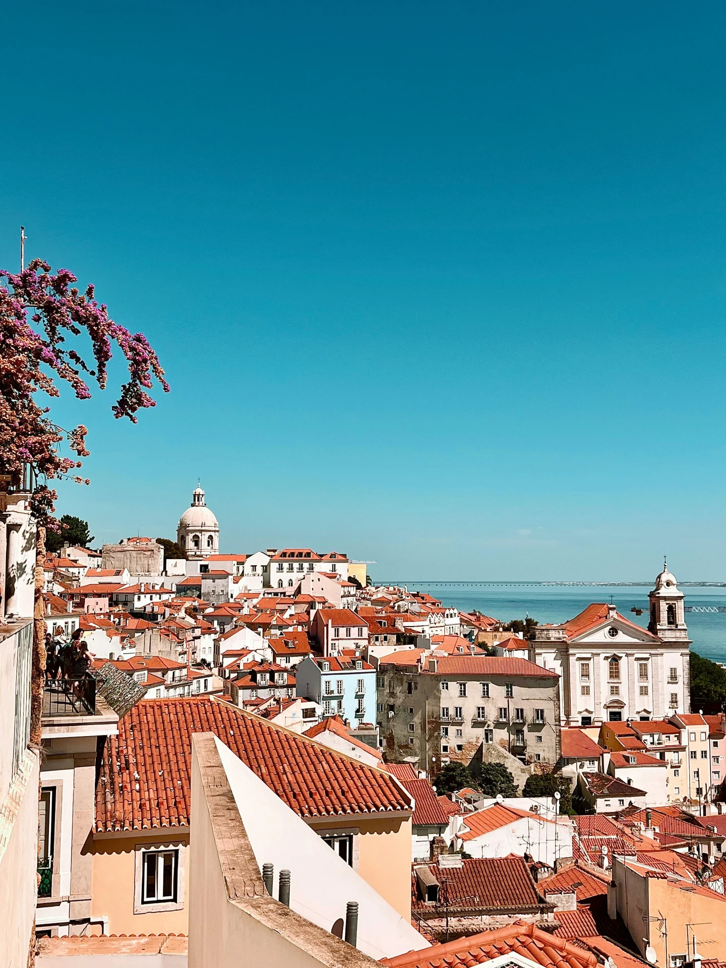 What to do in Lisbon? Explore Alfama, Lisbon’s oldest district, filled with winding streets, Fado music, and breath-taking viewpoints over the city.