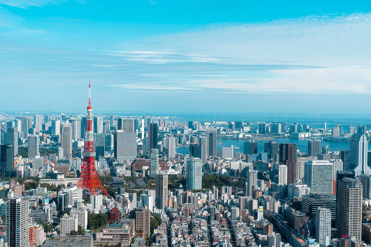 A panoramic view of Tokyo with Tokyo Tower, illustrating the urban landscape and the cost of living in Japan for those considering relocation.