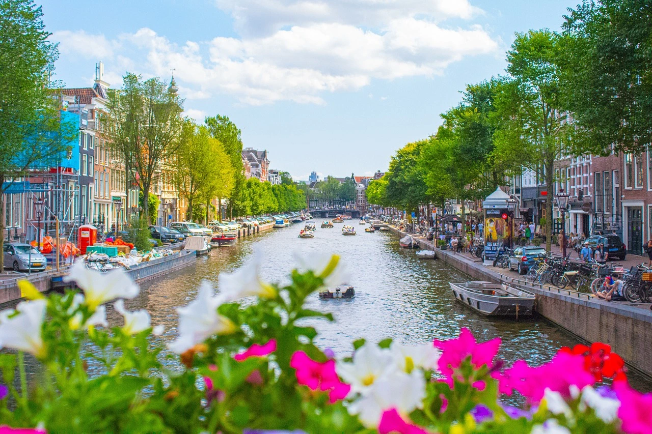 Scenic canal view in Amsterdam, Netherlands, showcasing the city's vibrant lifestyle