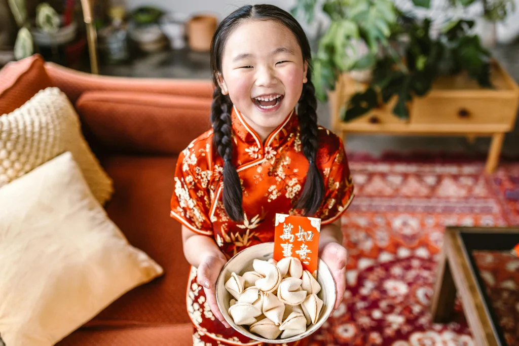 Schools in China-expatis-Chinese girl dressed in red smiling