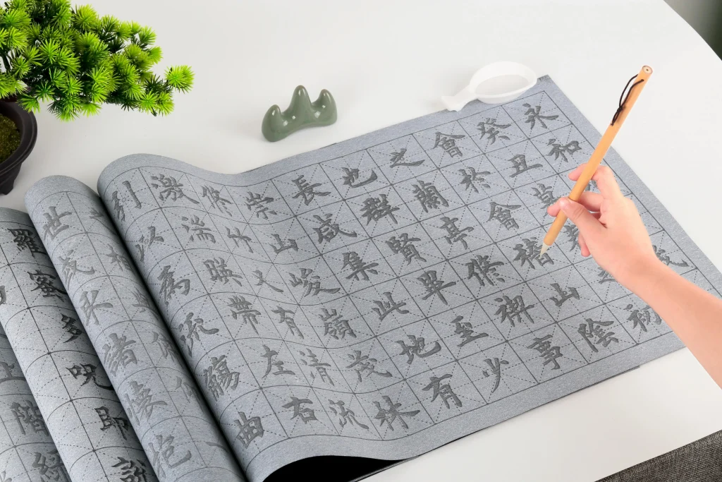 Schools in China-expatis-discipline- a person drawing kanjis