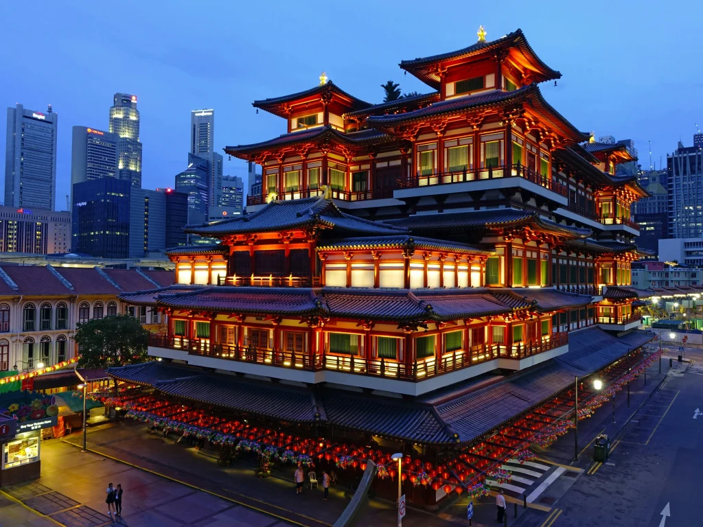 Cost of living in Singapore varies, with cultural heritage in Chinatown offering a contrast to the city’s upscale business districts.