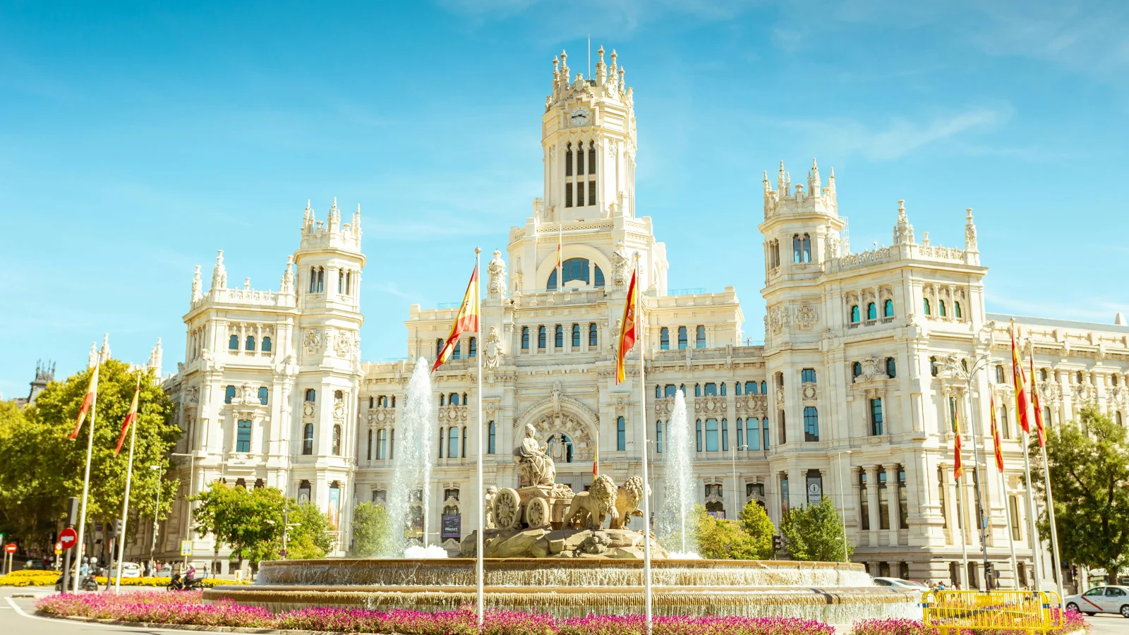 The iconic Palacio de Cibeles with its stunning architecture and the famous Cibeles Fountain in the foreground, a must-see landmark in the Spanish capital.