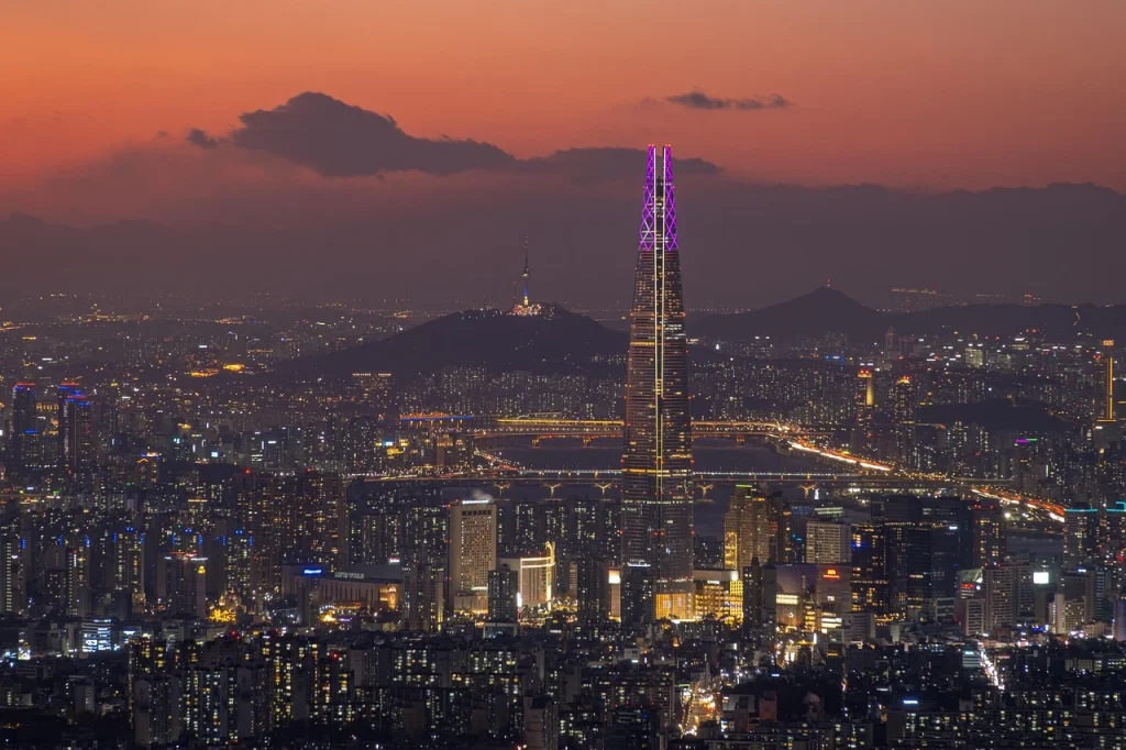 Skyline of Seoul at night with Lotte World Tower illuminated — one of the most iconic cities in South Korea for expats and travellers alike.