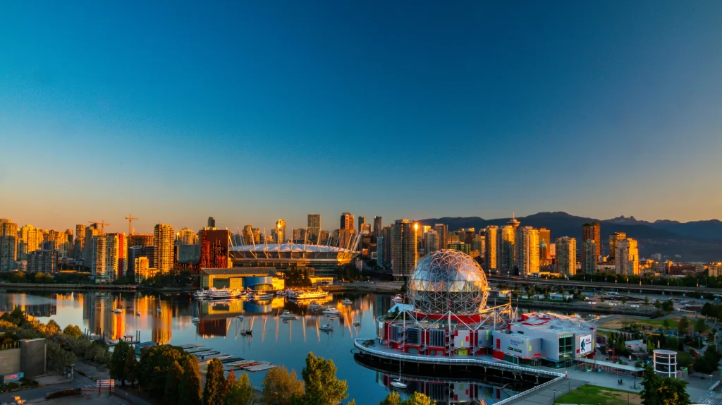 Vancouver cityscape at dusk, highlighting why it's among the best places to live in Canada, with stunning waterfront views and a dynamic urban atmosphere.