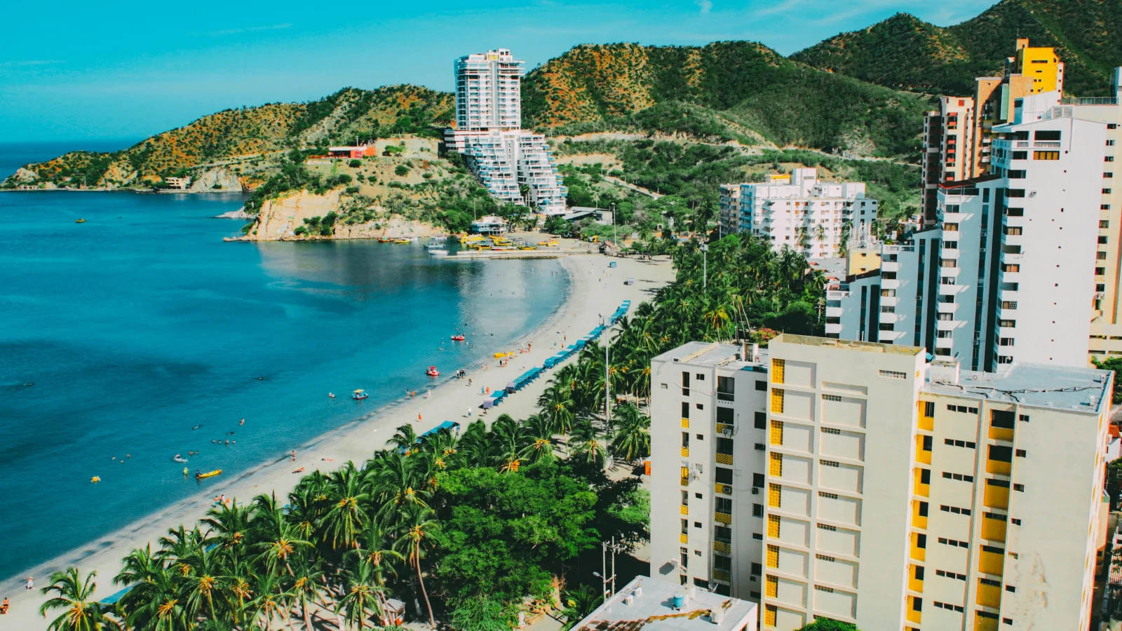 View of beachfront apartments in Santa Marta, Colombia, representing lifestyle options and the cost of living in Colombia for expats.