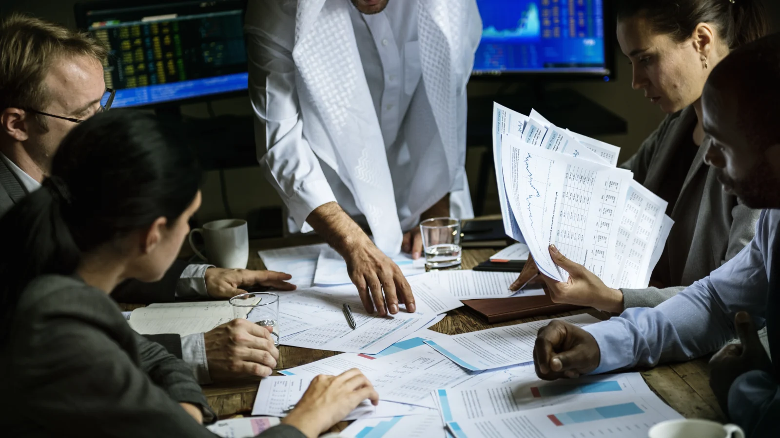 Group of business people going over Dubai taxes