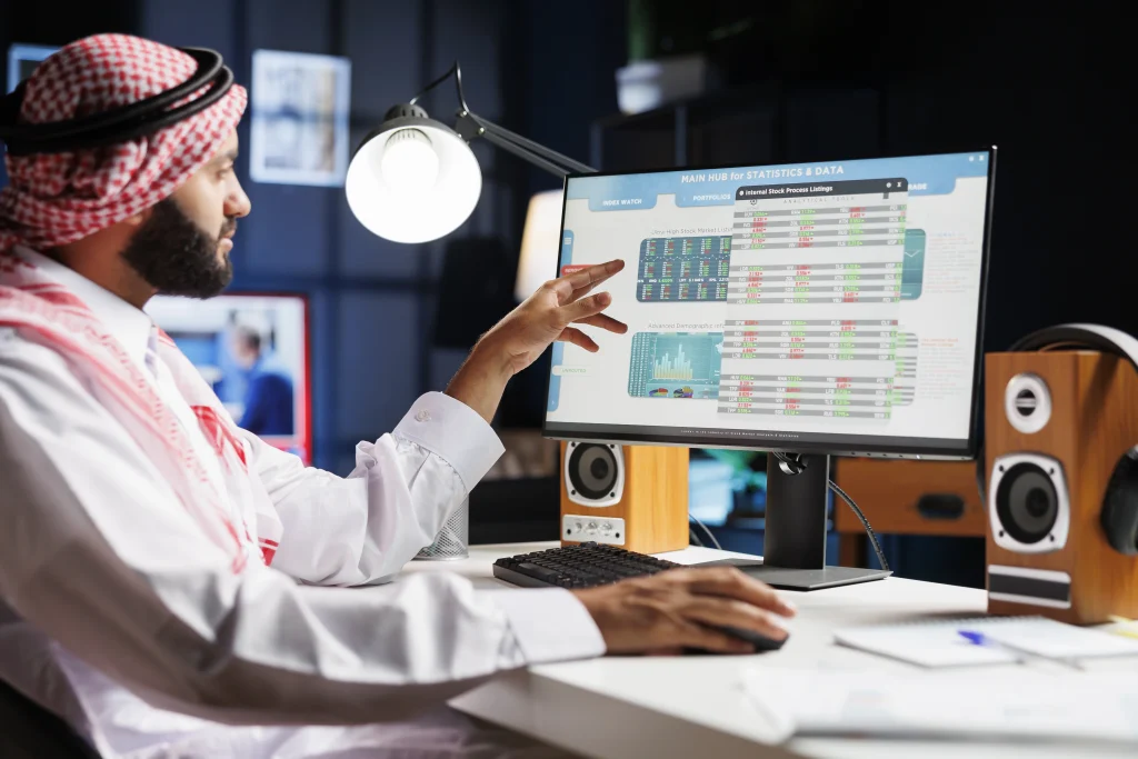 Muslim guy checking his taxes in Dubai