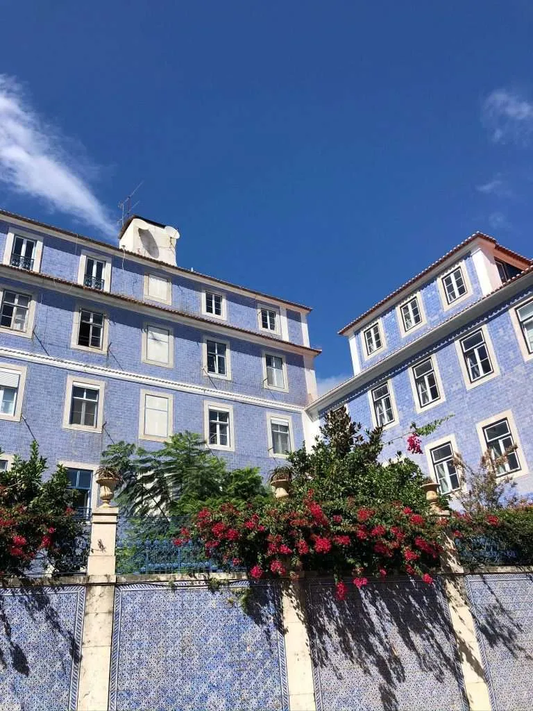 Beautiful blue mosaic facade of apartments in Lisbon. Showcasing the Portuguese culture and housing market