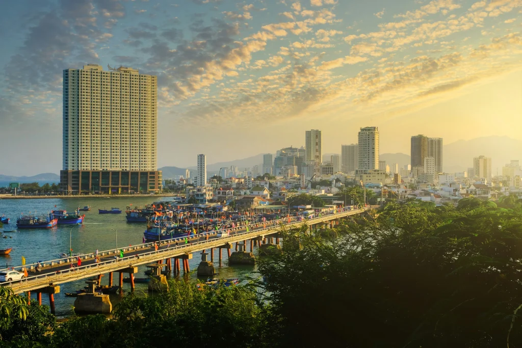 Sunrise view of Nha Trang city and fishing boats near the central bridge, Vietnam