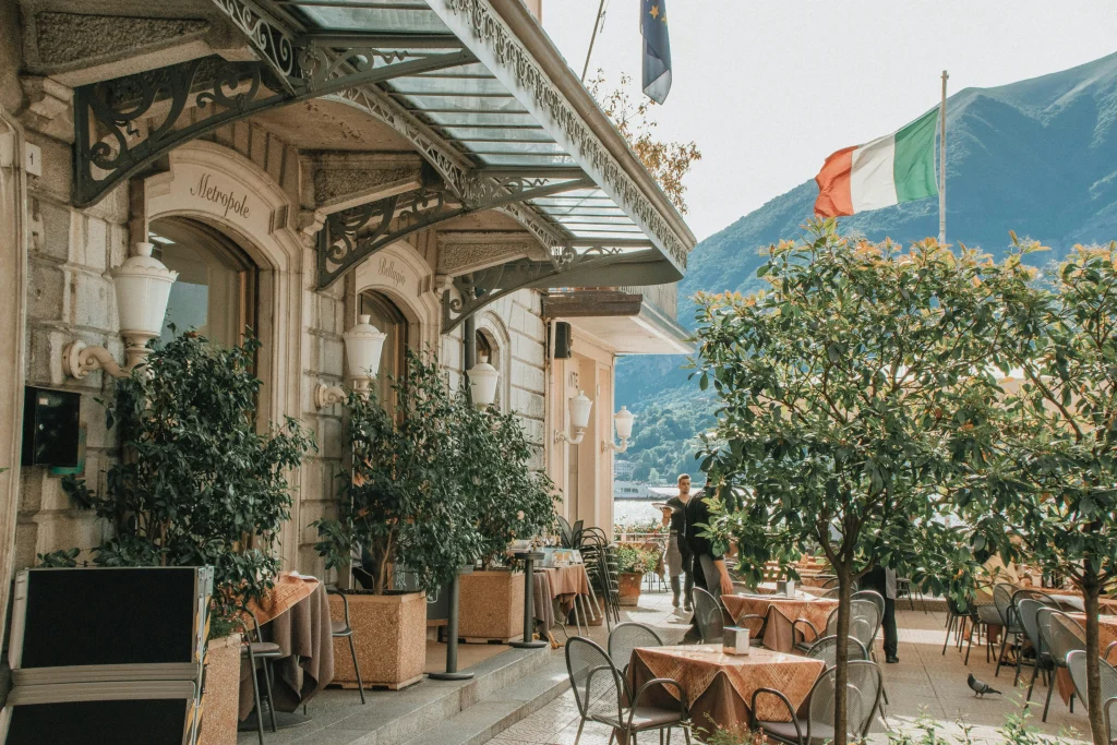 Outdoor café in northern Italy, reflecting lifestyle considerations and cost-of-living impacts tied to taxes in Italy.