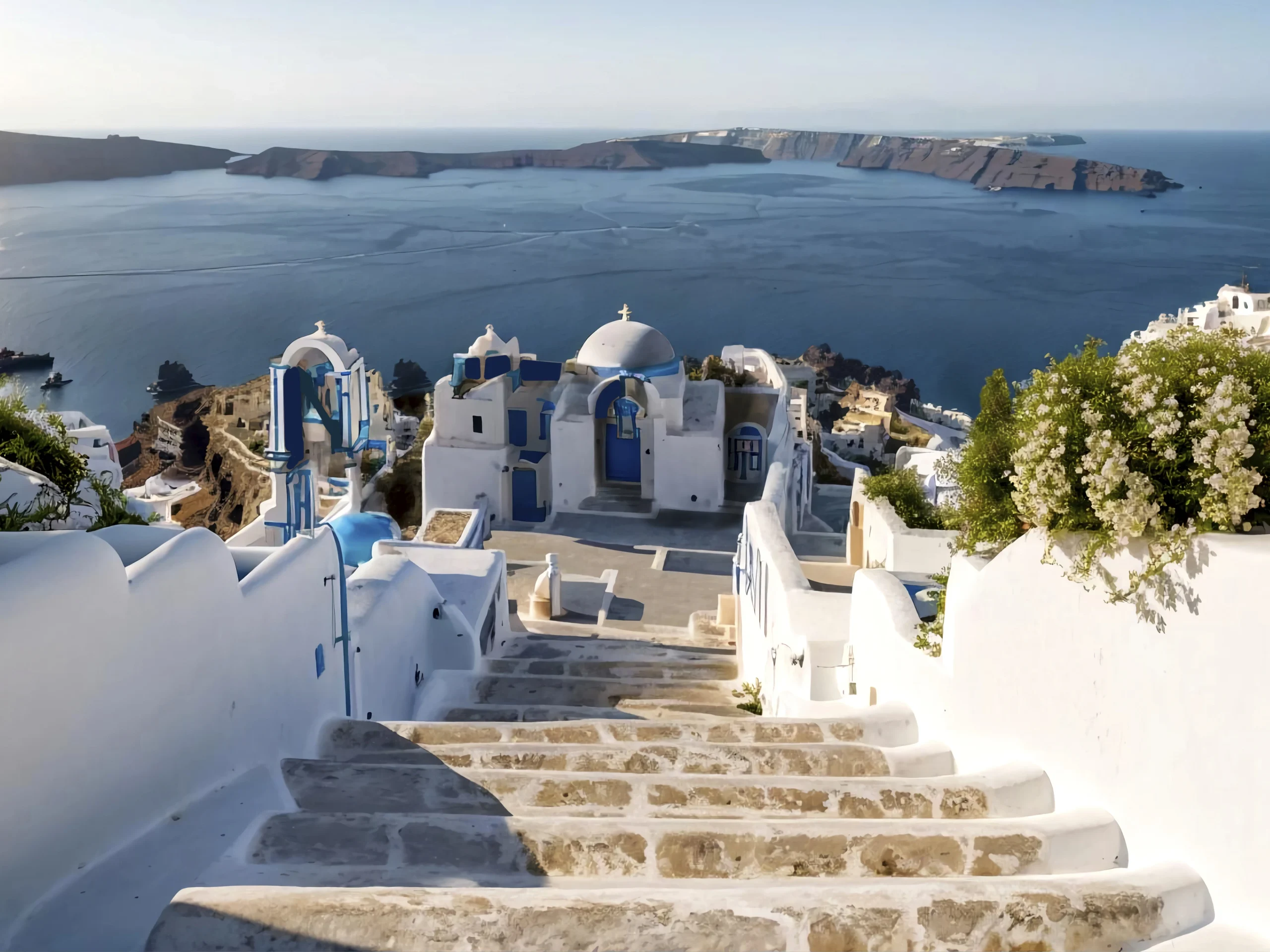 Santorini panorama: steps, Greek church, and blue caldera.