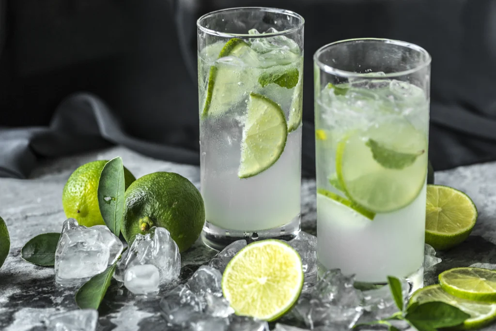 Two Brazilian caipirinha glasses with lime, crushed ice, and cachaça—a refreshing cocktail and iconic symbol of Brazil’s festive culture.