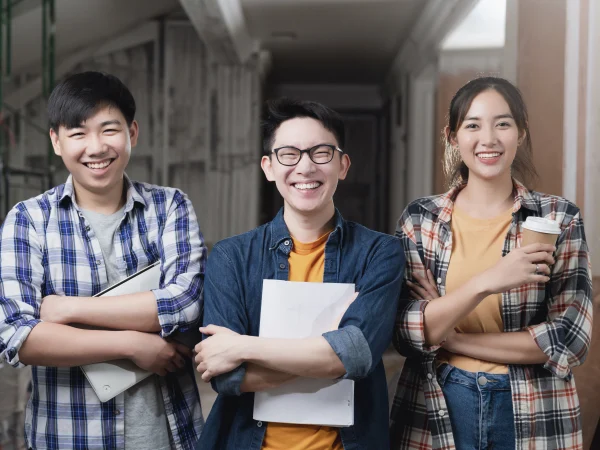 Smiling international students in China discussing their student housing, symbolizing university life and student residences.