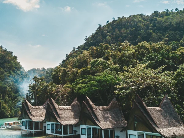 Housing in Indonesia, overwater bungalows in a tropical lagoon.