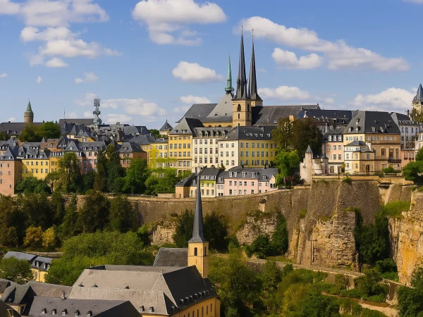 Panoramic view of Luxembourg City featuring the old town, its cliffs, and the cathedral spires, a symbol of housing in Luxembourg in 2025.