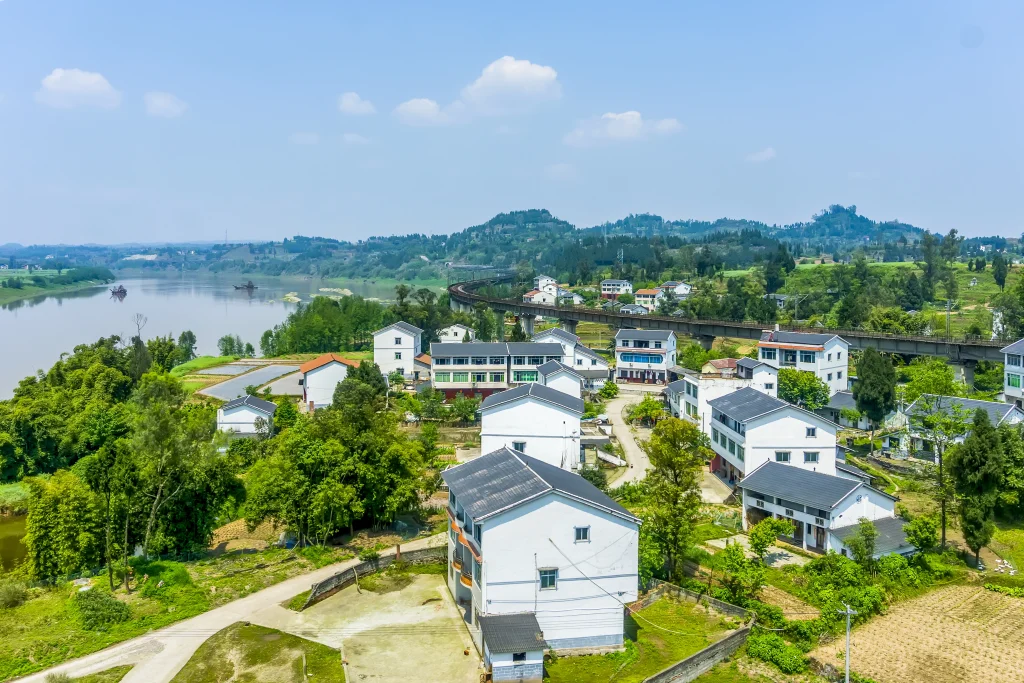 Residential neighborhood in Vietnam with modern houses surrounded by greenery, typical of the suburban areas where students live.